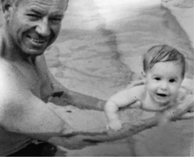 Wayne Steimle with his baby son in the pool