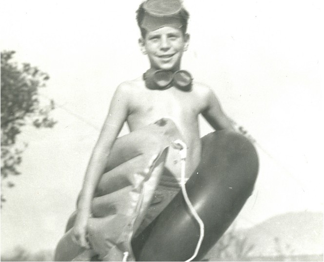 Wayne Steimle as young boy with swim goggles and pool tube