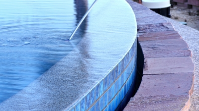 Infinity spa edge and water feature detail Photo