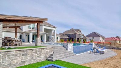 Custom backyard landscape and patio Photo