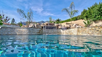 Custom freeform pool with waterfall Photo