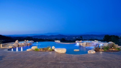 Illuminated freeform pool at night Photo