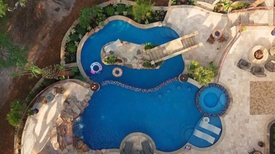 Custom freeform pool and spa combination from above Photo