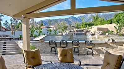 Covered outdoor patio seating area Photo