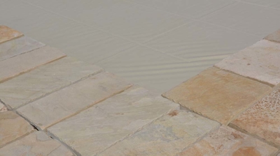 Closed pool cover with stone edge detail Photo