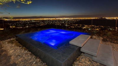Illuminated square spa at night Photo