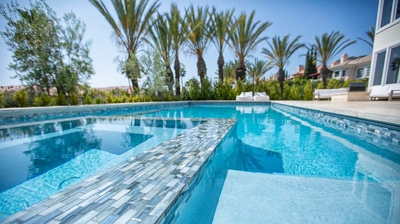 Combination pool and spa with custom tilework Photo