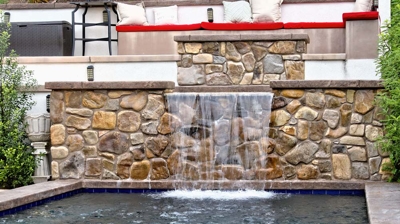 Custom stone waterfall and masonry Photo
