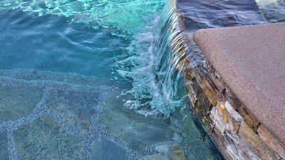 Waterfall from spa into pool Photo