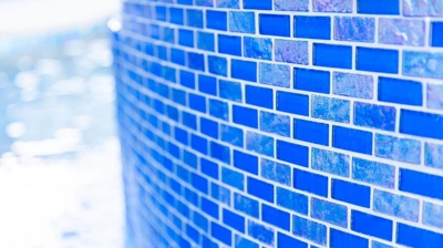 Striking blue tile of an above ground spa. Photo