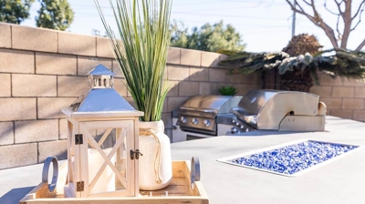 Enjoy alfresco dining on the patio featuring a BBQ grill, seating, and a fire pit. Photo