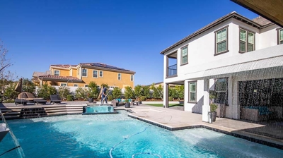 Modern backyard pool and patio area Photo