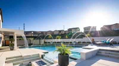 Unique pool design with multiple water features Photo