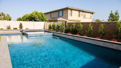 Stylish outdoor haven with a seamlessly incorporated spa and pool. Photo