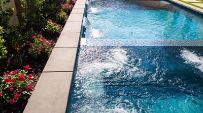 Modern backyard sanctuary boasting a harmonious blend of a pool and a spa. Photo