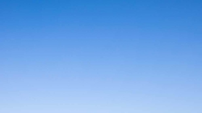 Elegant backyard hideaway featuring a pool and spa seamlessly nestled within grass pavers. Photo