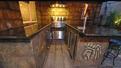 Enigmatic island-themed outdoor kitchen and bar sanctuary. Photo