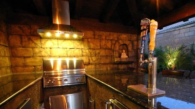 Ethereal island-inspired kitchen and bar area for outdoor entertaining. Photo