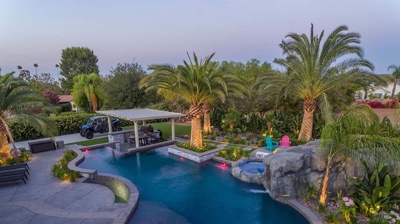 Aerial view of pool and patio alongside a serene view. Photo