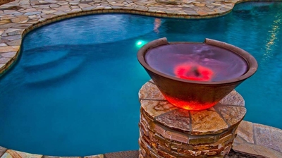 Pool with a view of bucket of water design. Photo