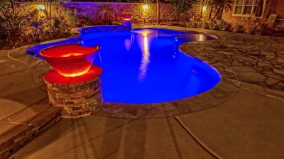 Pool with a view of bucket of water design of waterfall. Photo