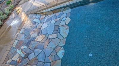 Stone details of design within pool. Photo