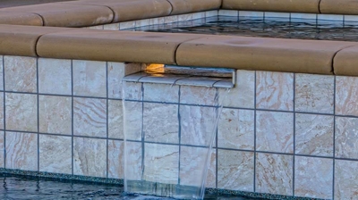 Small waterfall flowing into pool. Photo