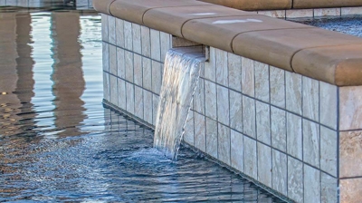 Small waterfall flowing into pool. Photo