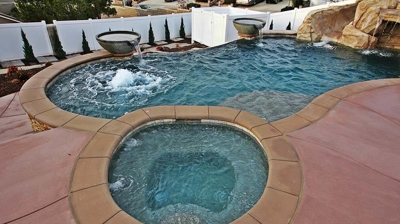 Beautiful outdoor pool with jacuzzi. Photo