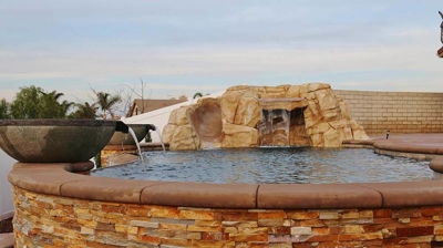 Beautiful outdoor jacuzzi with stone work. Photo