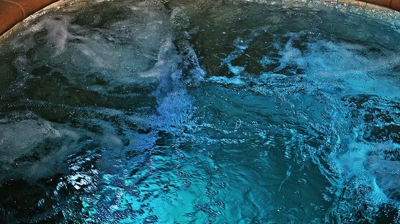 Pool water with blue lighting at night. Photo
