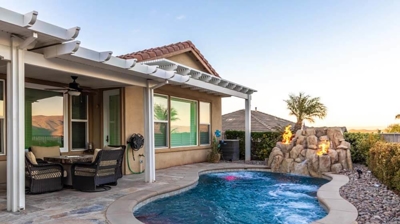 Hidden backyard gem offering a pool nestled within hedges. Photo