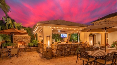 Tropical hideaway with palm tree borders with an outdoor living space. Photo