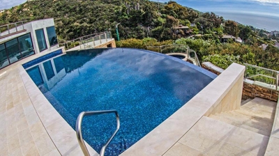 Outdoor pool with gorgeous view in background. Photo