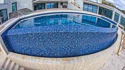 Overhead view of clean and brand new pool in backyard. Photo