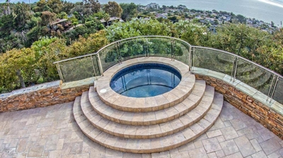 View of jacuzzi with stone floor. Photo