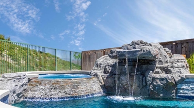 Waterfall Pouring into Pool Photo
