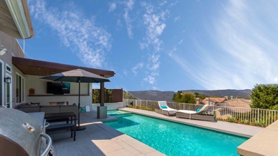 Outdoor Kitchen and Pool Photo