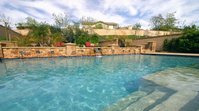 View over pool stairs with custom masonry work Photo