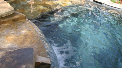 Waterfall spillway into pool Photo