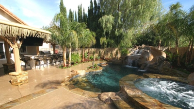 Immersive patio design with outdoor bar and pool area Photo