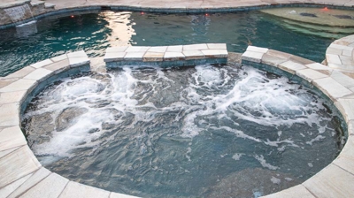 Freeform spa design with spillways Photo