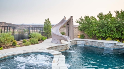 Pool with slide and spa Photo