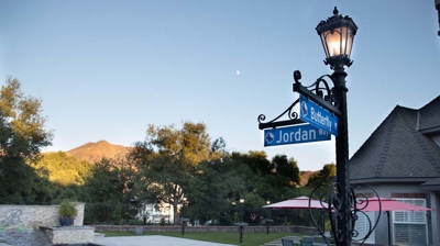 Backyard pool area with custom signage and lighting Photo