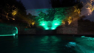 Pool with custom lighting at night Photo