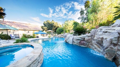 Unique freeform pool design with spa and waterfall Photo