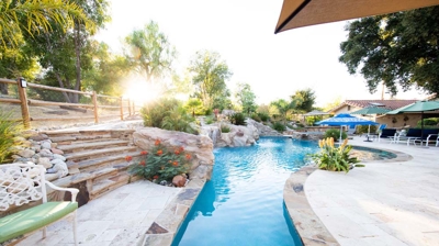 Custom freeform pool with unique masonry work Photo