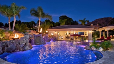 Outdoor pool with jacuzzi and patio covered kitchen Photo