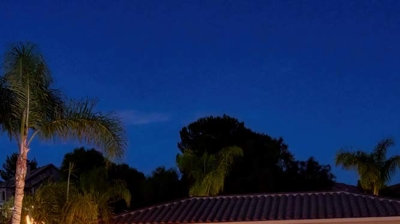 Outdoor pool at twilight with fire bowl features Photo