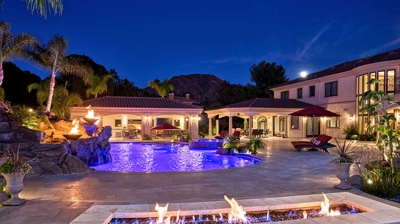 Fire pit next to outdoor pool Photo